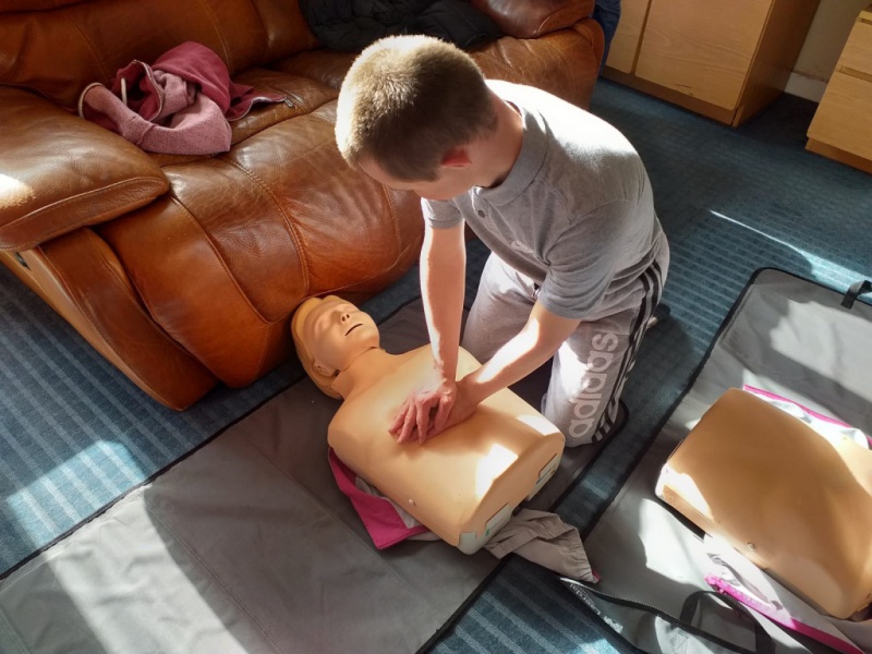 residents at Diagrama's care home Cabrini House pratice in first aid training